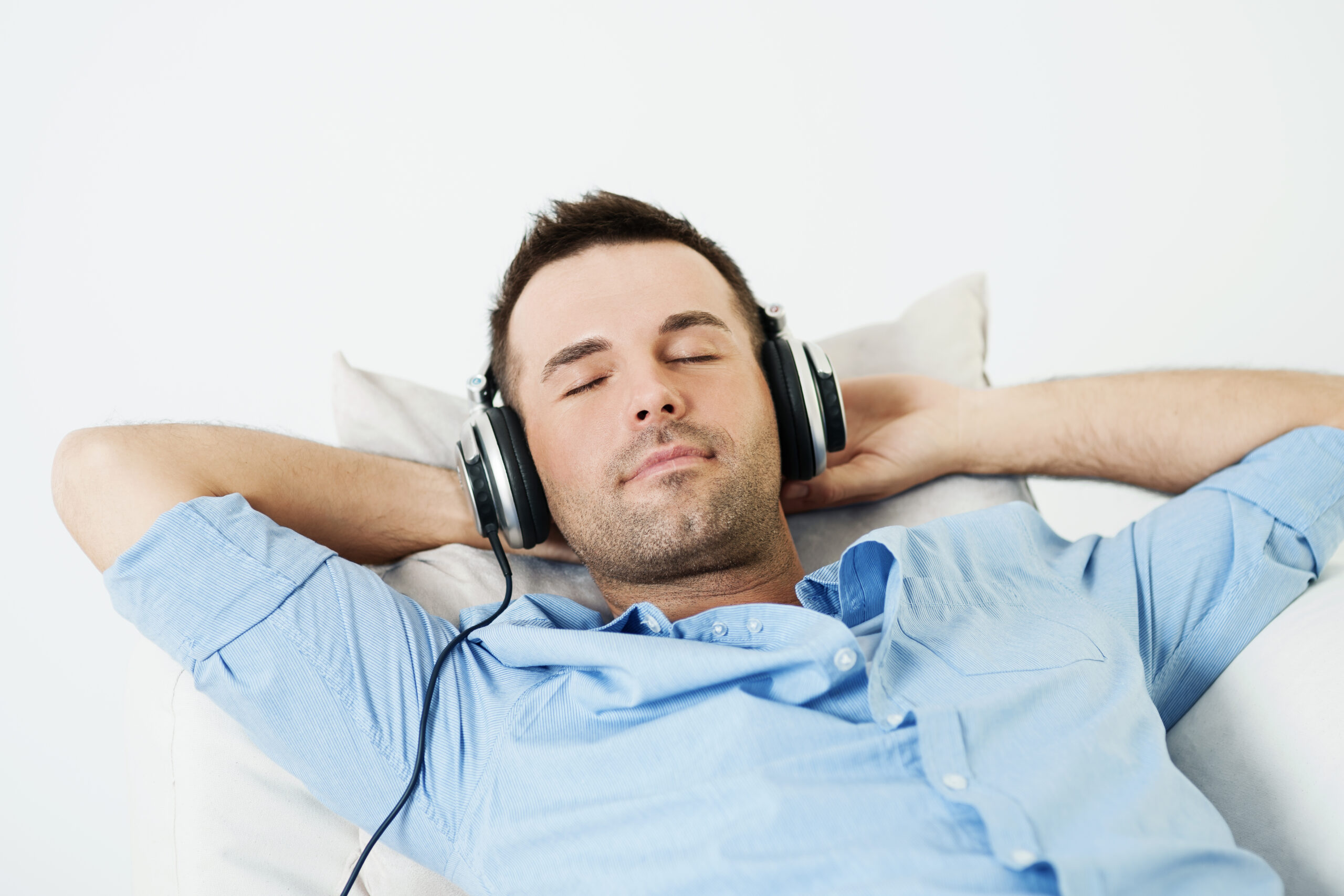 Resting comfortably with over-ear headphones during BioAcoustic listening
